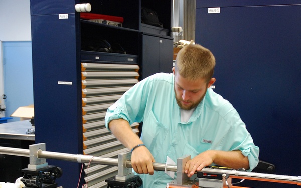 AFRL/RW scientist working in a testing laboratory