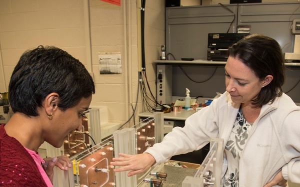 AFRL/RW scientist working in a photonics laboratory.