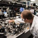 AFRL/RW scientist works on an experiment in a photonics laboratory