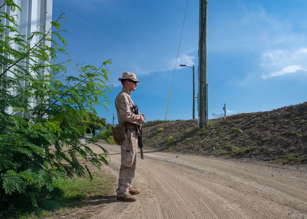 U.S Marines provide security during illegal alien arrival flight