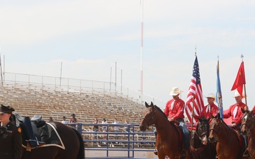 Artillery Half Section presents color guard and riderless horse