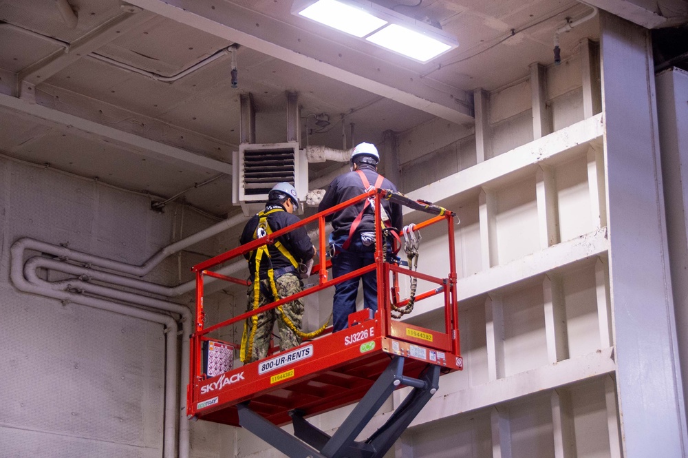 USS Ronald Reagan (CVN 76) conducts daily maintenance operations