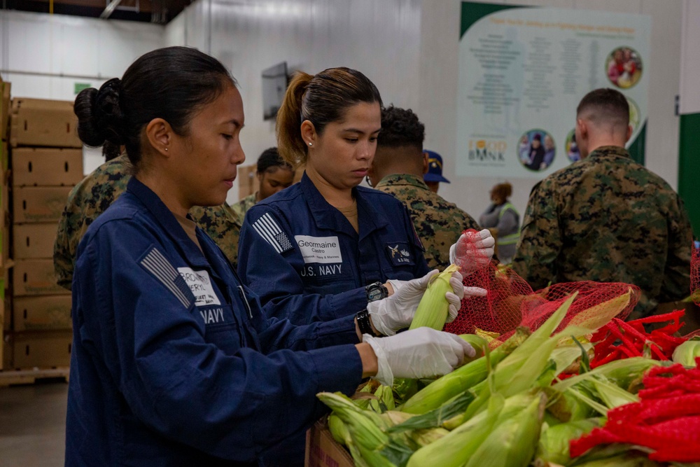 Sailors and Marines volunteer at the Los Angeles Regional Food Bank for LA Fleet Week