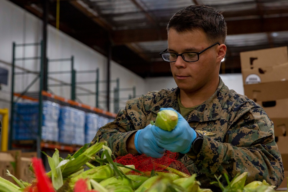 Sailors and Marines volunteer at the Los Angeles Regional Food Bank for LA Fleet Week