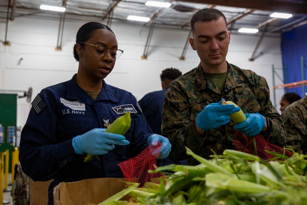 Sailors and Marines volunteer at the Los Angeles Regional Food Bank for LA Fleet Week