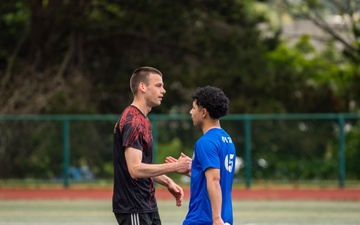 USS Ronald Reagan (CVN 76) Sailors play in an intramural soccer game