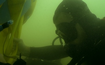 MDSU-1 divers install buoys and anchors around USS Arizona Memorial