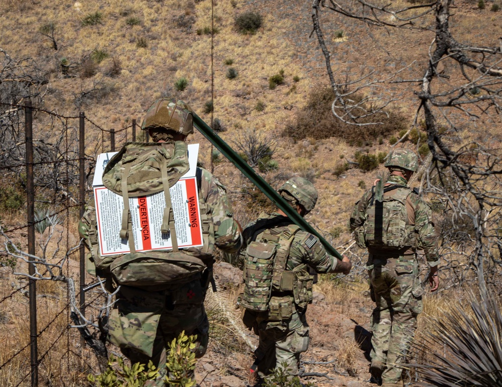 Aerial supply drop supports NMNDA sign installation