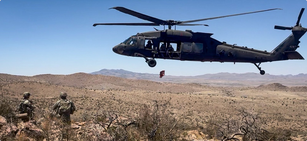 Aerial supply drop supports NMNDA sign installation