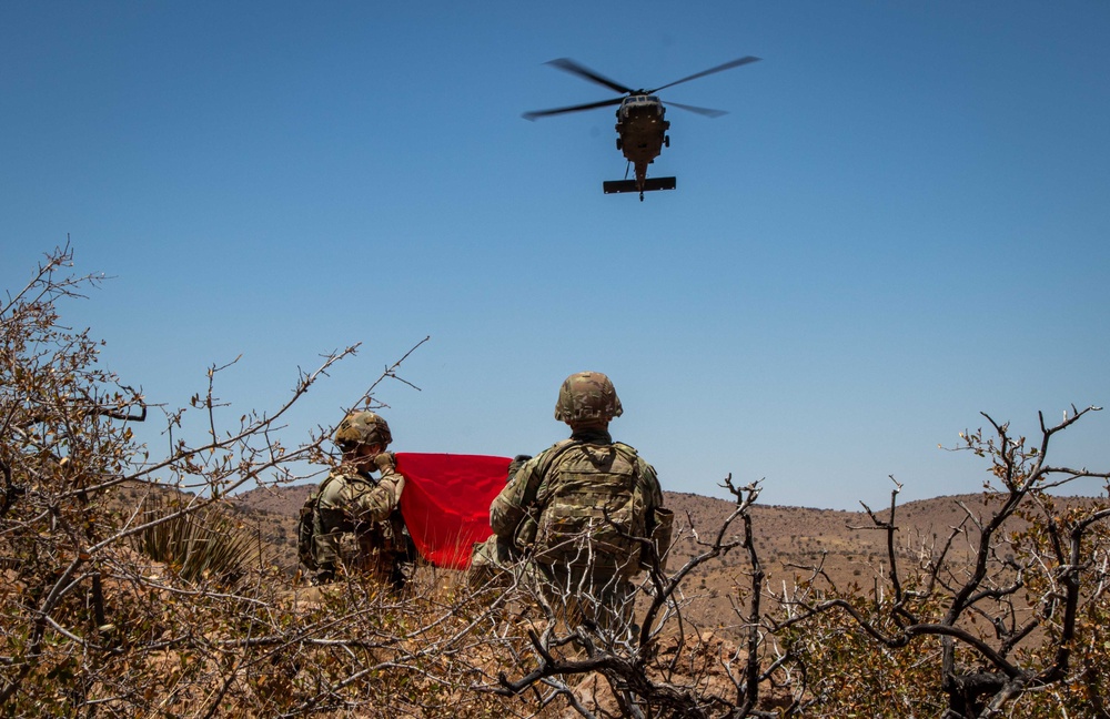 Aerial supply drop supports NMNDA sign installation