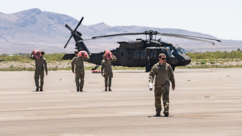 Aerial supply drop supports NMNDA sign installation