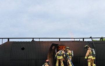 Firefighters face the flames