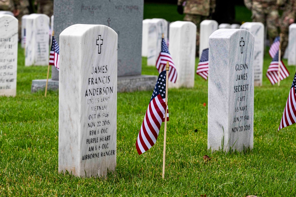 U.S. Army Soldiers assigned to the 3d U.S. Infantry Regiment (The Old Guard), participate in Flags In at Arlington National Cemetery.
