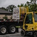 23 LRS Deployment and Distribution Team offloads deployment cargo