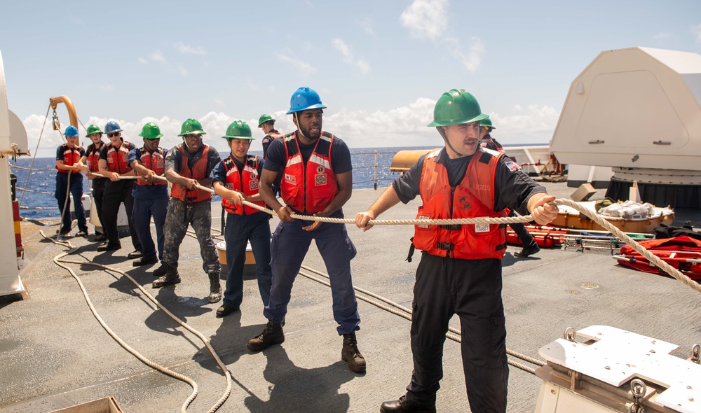 U.S. Coast Guard Cutter Stratton crew participate in a man overboard drill while patrolling the Pacific Ocean