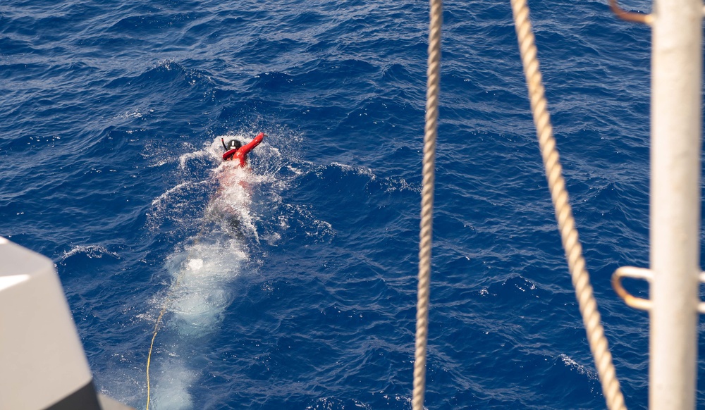 U.S. Coast Guard Cutter Stratton crew participate in a man overboard drill while patrolling the Pacific Ocean