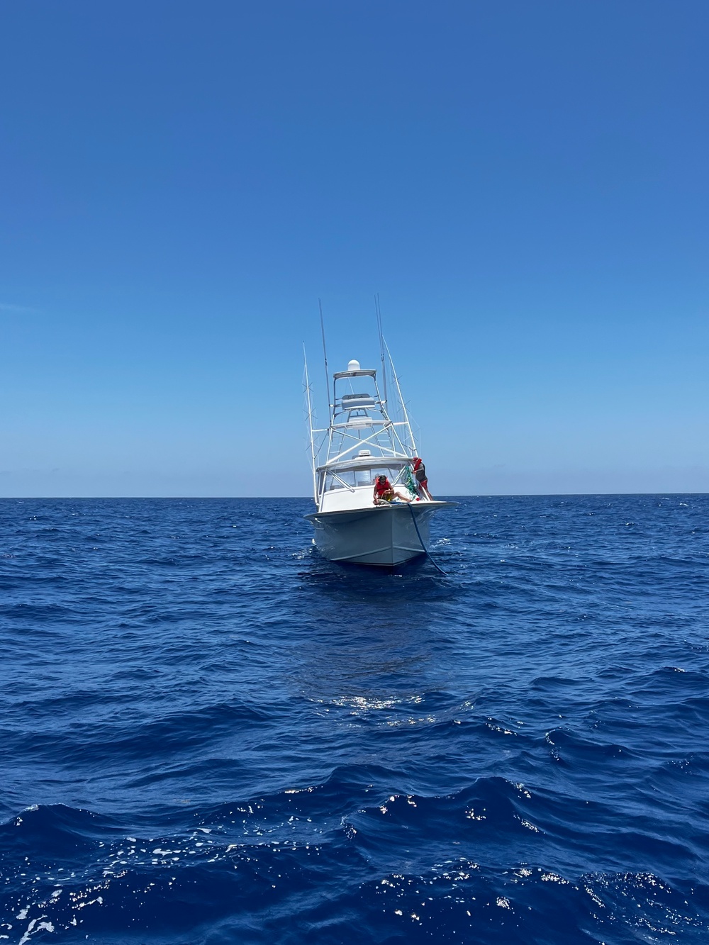 U.S. Coast Guard Station Canaveral boat crew members assist disabled vessel