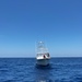 U.S. Coast Guard Station Canaveral boat crew members assist disabled vessel