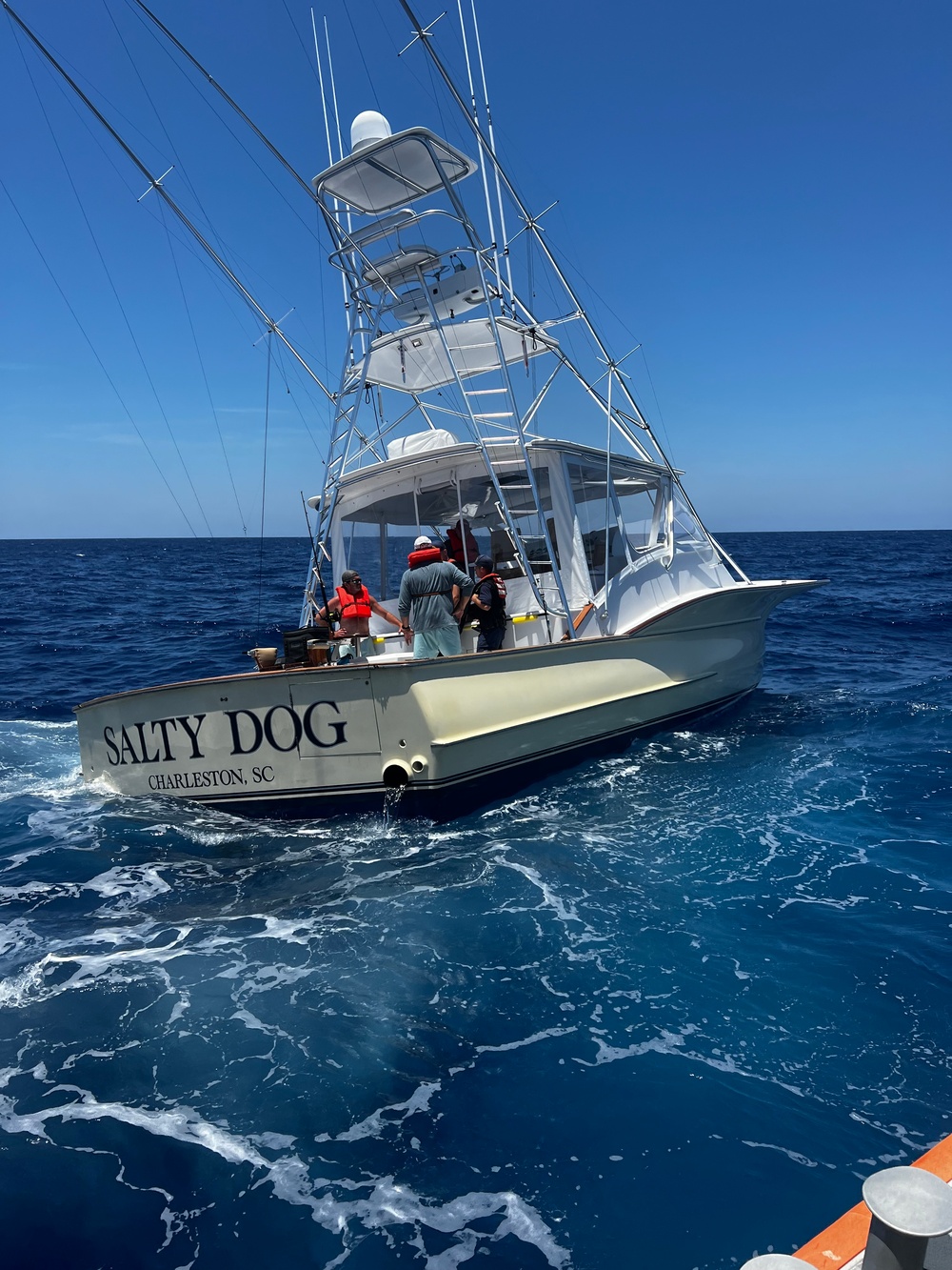 U.S. Coast Guard Station Canaveral boat crew members assist disabled vessel