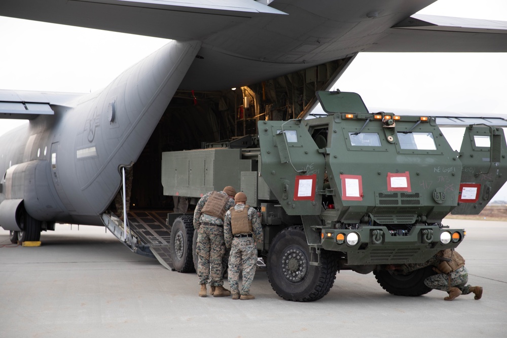 Marines Load High Mobility Artillery Rocket System (HIMARS) onto an Airforce C-130 Hercules during Swift Response