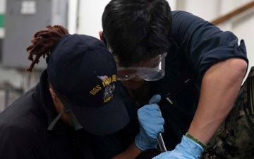 USS Kearsarge Sailors Conduct Maintenance