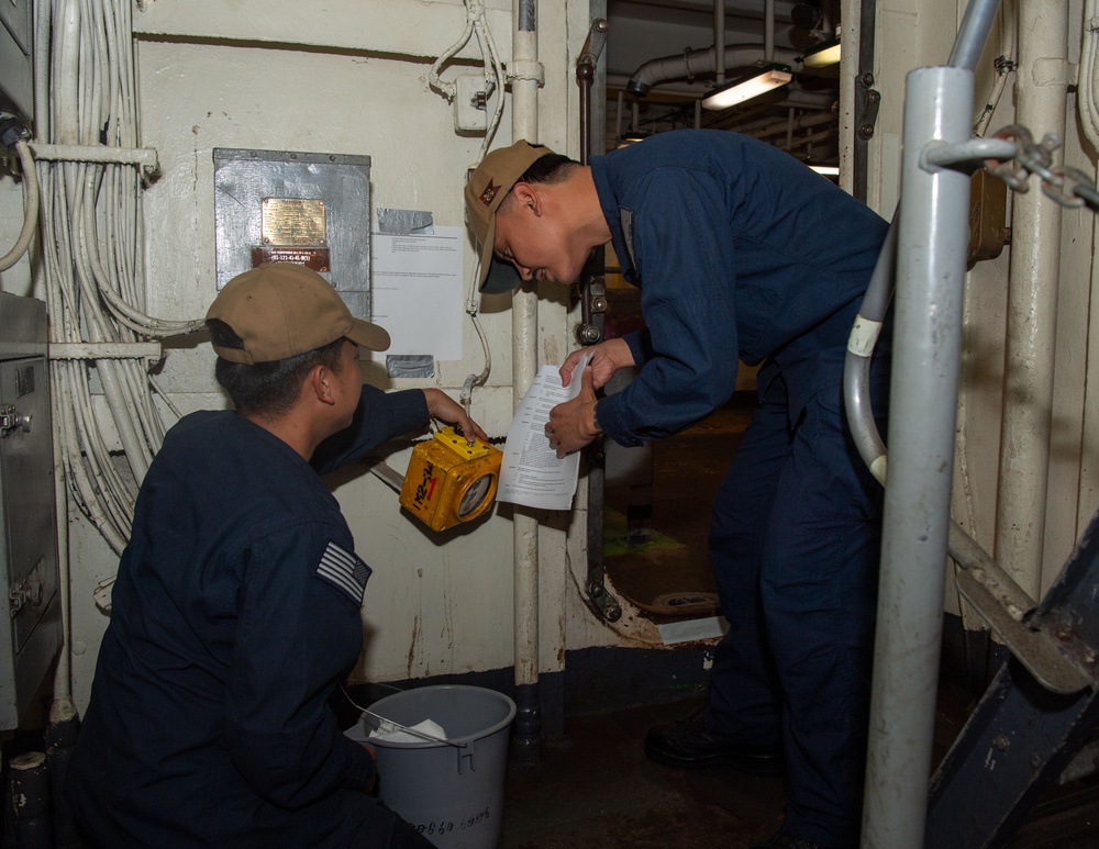 USS ESSEX SAILORS CONDUCT PRVENTATIVE MAINTENANCE ON SAFETY EQUIPMENT