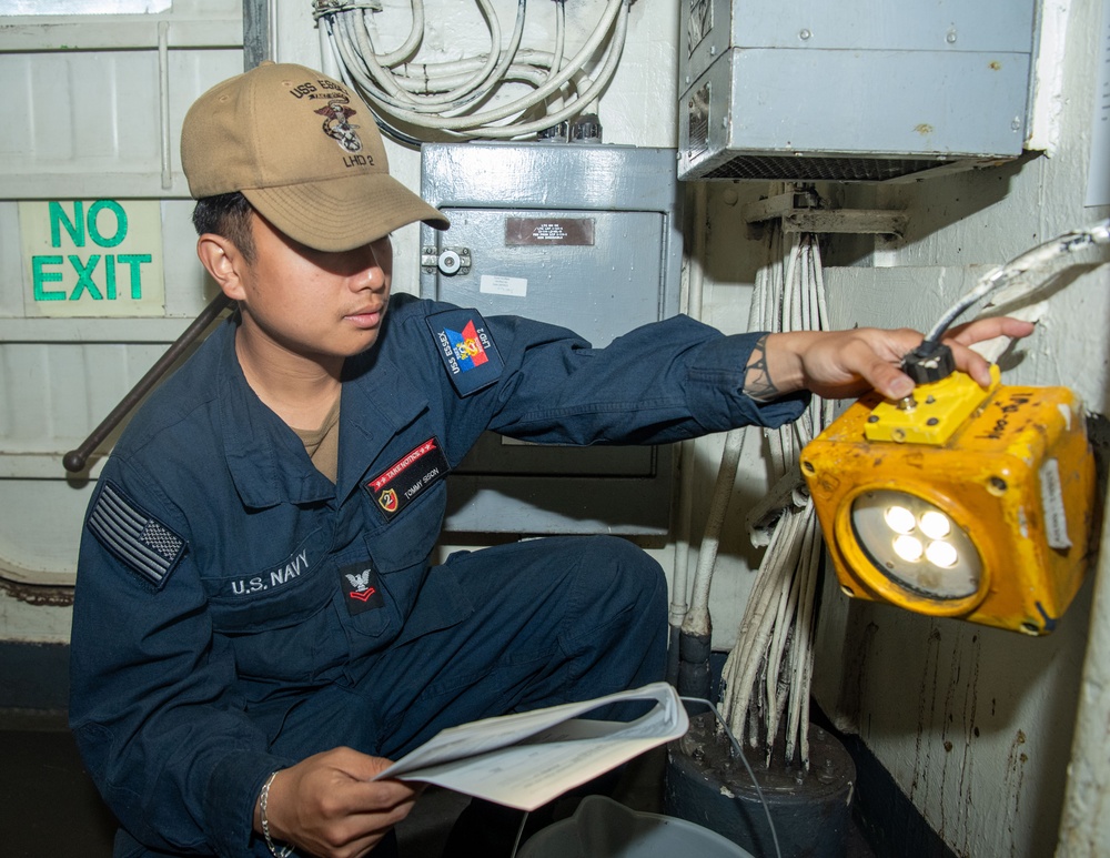 USS ESSEX SAILORS CONDUCT PRVENTATIVE MAINTENANCE ON SAFETY EQUIPMENT
