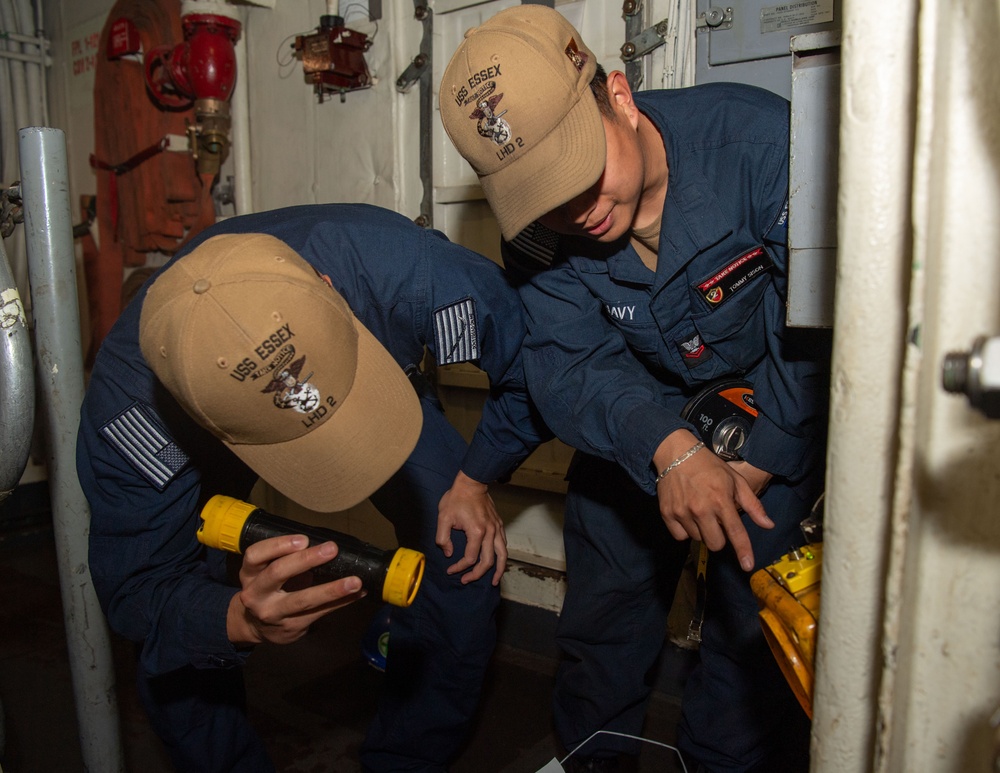 USS ESSEX SAILORS CONDUCT PRVENTATIVE MAINTENANCE ON SAFETY EQUIPMENT