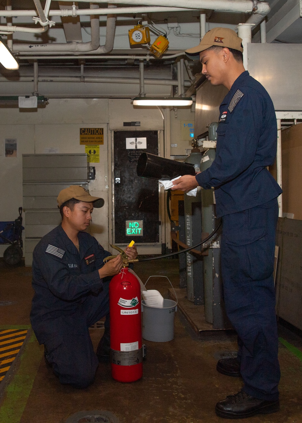 USS ESSEX SAILORS CONDUCT PRVENTATIVE MAINTENANCE ON SAFETY EQUIPMENT