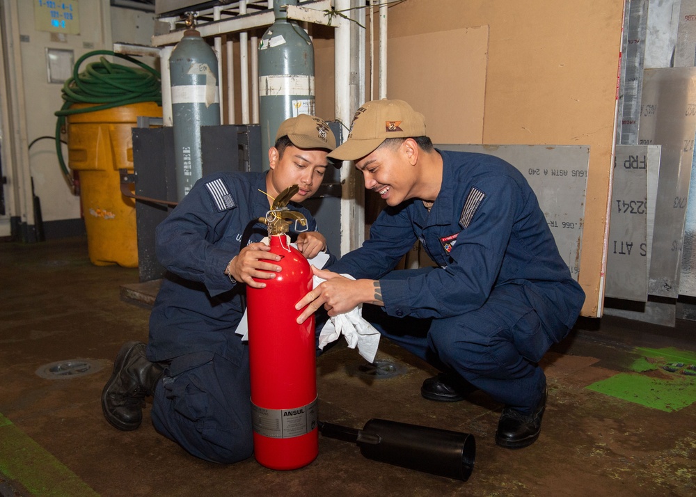 USS ESSEX SAILORS CONDUCT PRVENTATIVE MAINTENANCE ON SAFETY EQUIPMENT