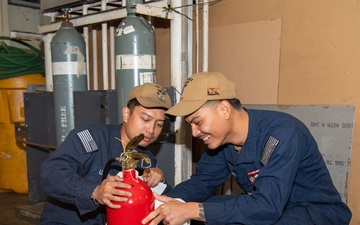 USS ESSEX SAILORS CONDUCT PRVENTATIVE MAINTENANCE ON SAFETY EQUIPMENT