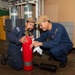 USS ESSEX SAILORS CONDUCT PRVENTATIVE MAINTENANCE ON SAFETY EQUIPMENT