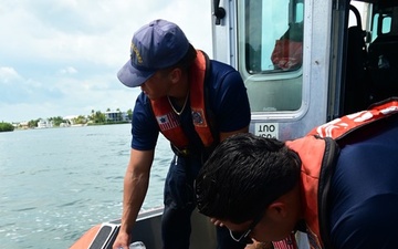 Station Islamorada crew members rescue sea turtle