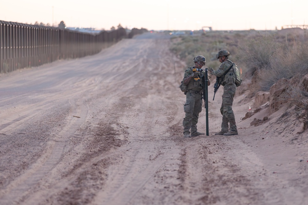 76th Engineer Company place signs along the New Mexico National Defense Area
