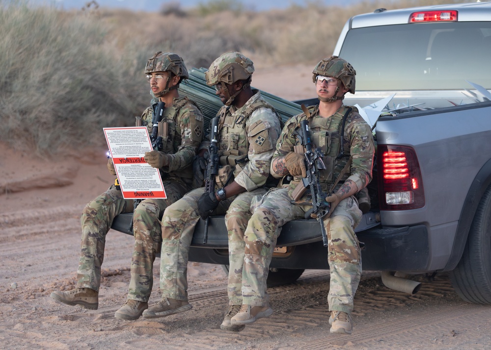 76th Engineer Company place signs along the New Mexico National Defense Area