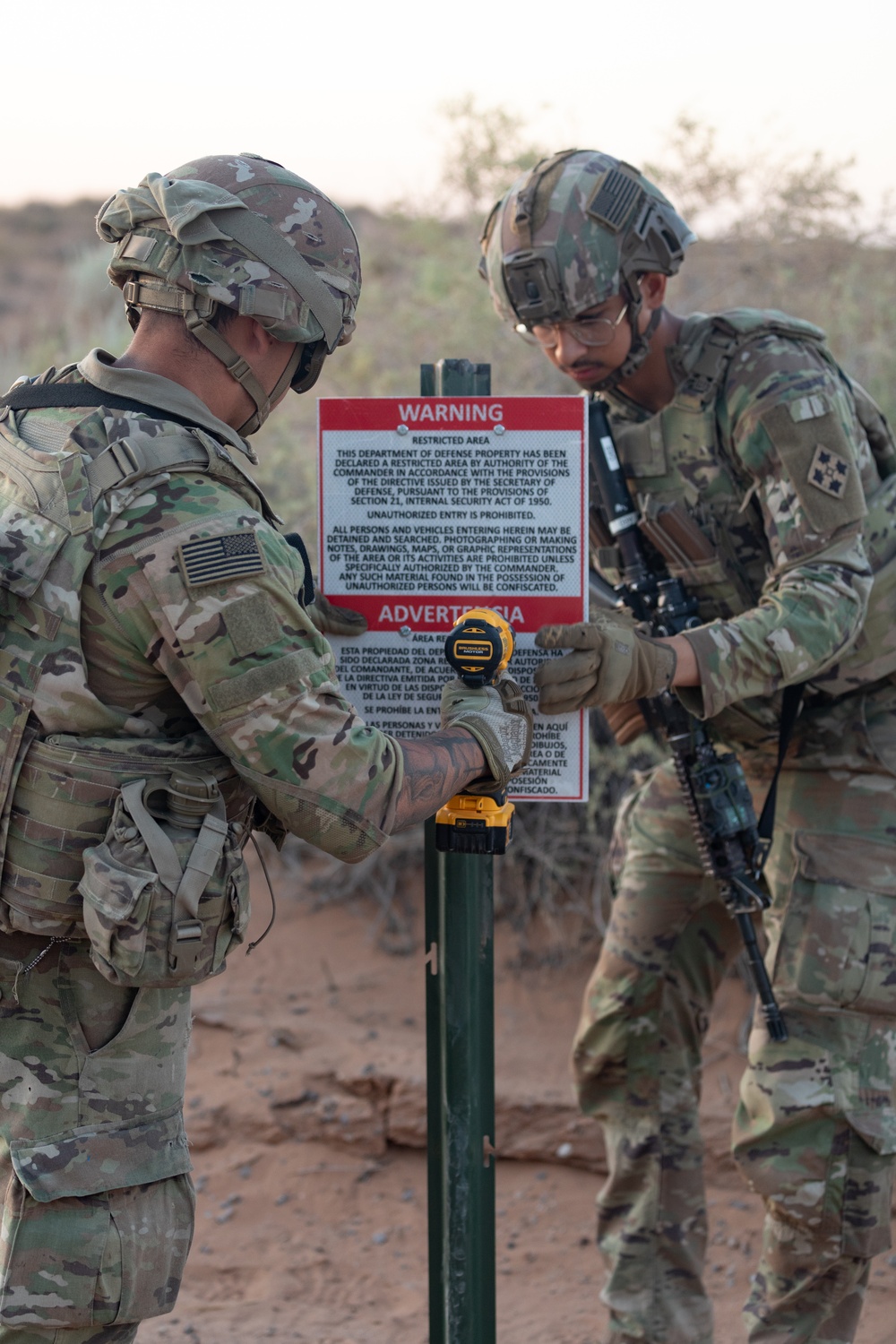 76th Engineer Company place signs along the New Mexico National Defense Area