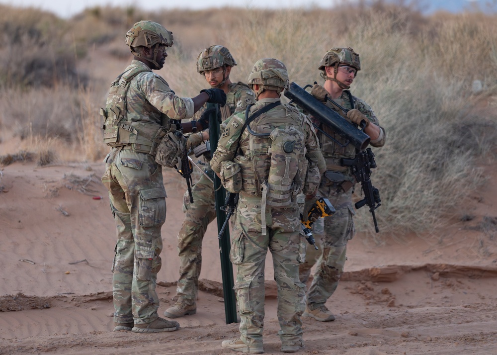 76th Engineer Company place signs along the New Mexico National Defense Area