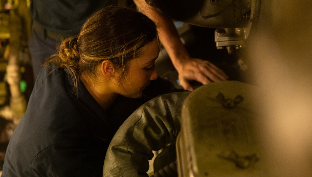 U.S. Coast Guard Cutter Stratton crewmembers conduct engineering work in machinery spaces during Indo-Pacific patrol