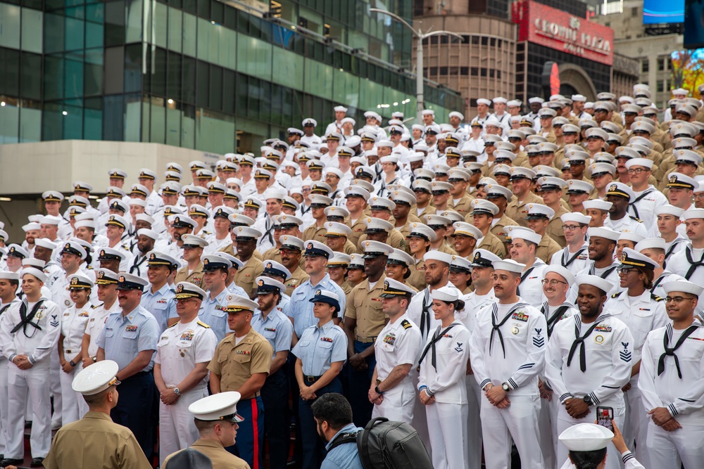 Service Members pose in Times Square during Fleet Week New York