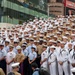 Service Members pose in Times Square during Fleet Week New York