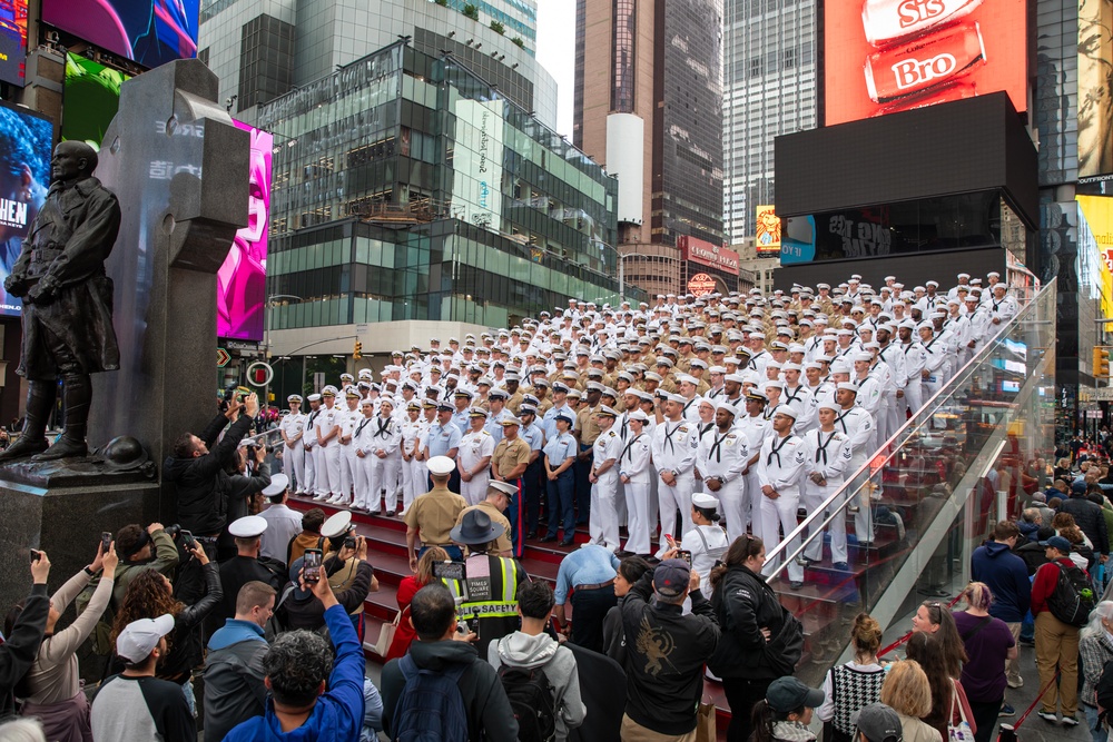 Service Members pose in Times Square during Fleet Week New York