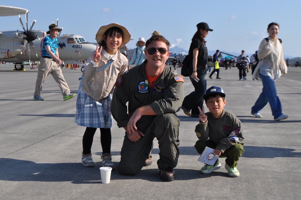 VP-8's LT Kaplan Poses with Local Japanese Citizens