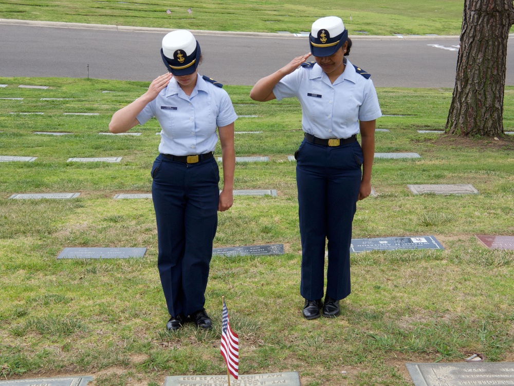 U.S. Coast Guard Academy cadets, from New London, Connecticut, salute a grave of a World War II veteran during a flag placing ceremony at Green Hills Memorial Park in Rancho Palos Verdes, California, May 24, 2025.