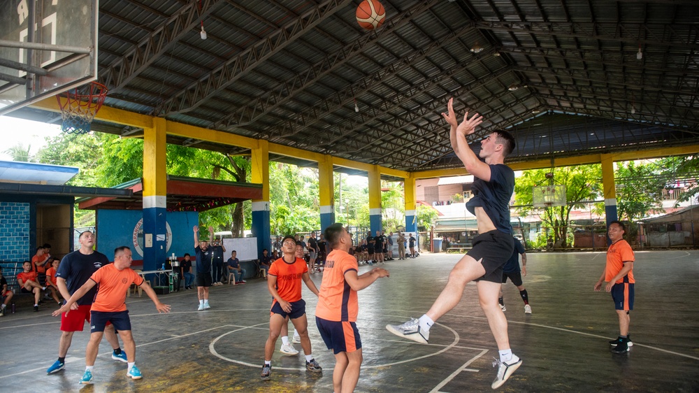 Members from the Legend-class USCGC Stratton compete in a game of basketball with Philippines Coast Guard in Puerto Princesa, Philippines