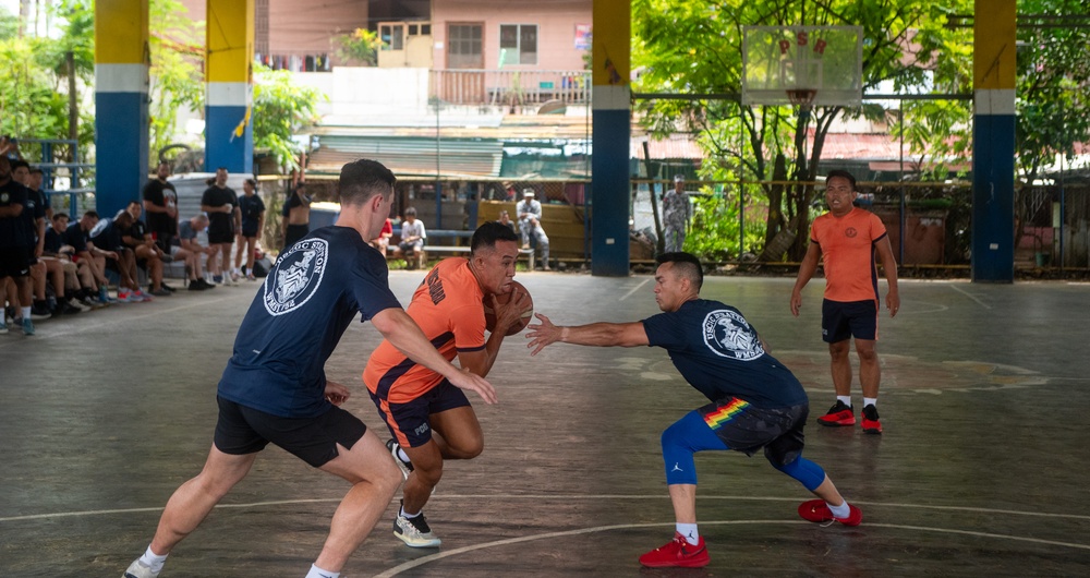 Members from the Legend-class USCGC Stratton compete in a game of basketball with Philippines Coast Guard in Puerto Princesa, Philippines