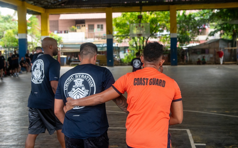 Members from the Legend-class USCGC Stratton compete in a game of basketball with Philippines Coast Guard in Puerto Princesa, Philippines