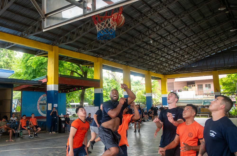 Members from the Legend-class USCGC Stratton compete in a game of basketball with Philippines Coast Guard in Puerto Princesa, Philippines