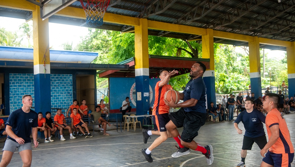 Members from the Legend-class USCGC Stratton compete in a game of basketball with Philippines Coast Guard in Puerto Princesa, Philippines