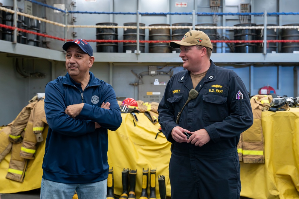 Congressman Gilbert R. Cisneros Jr. tours the USS Harpers Ferry (LSD 49)