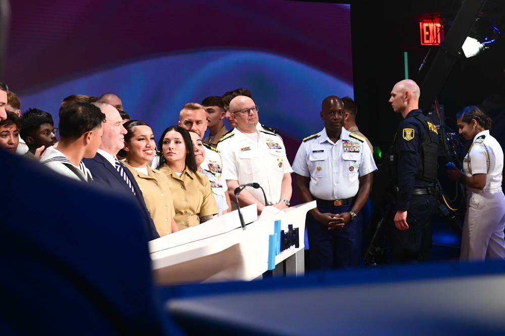 Service members of the U.S. Coast Guard,  Navy and Marine Corps ring the Nasdaq Opening Bell at the MarketSite in Times Square, officially marking the start of the trading day during Fleet Week New York 2025